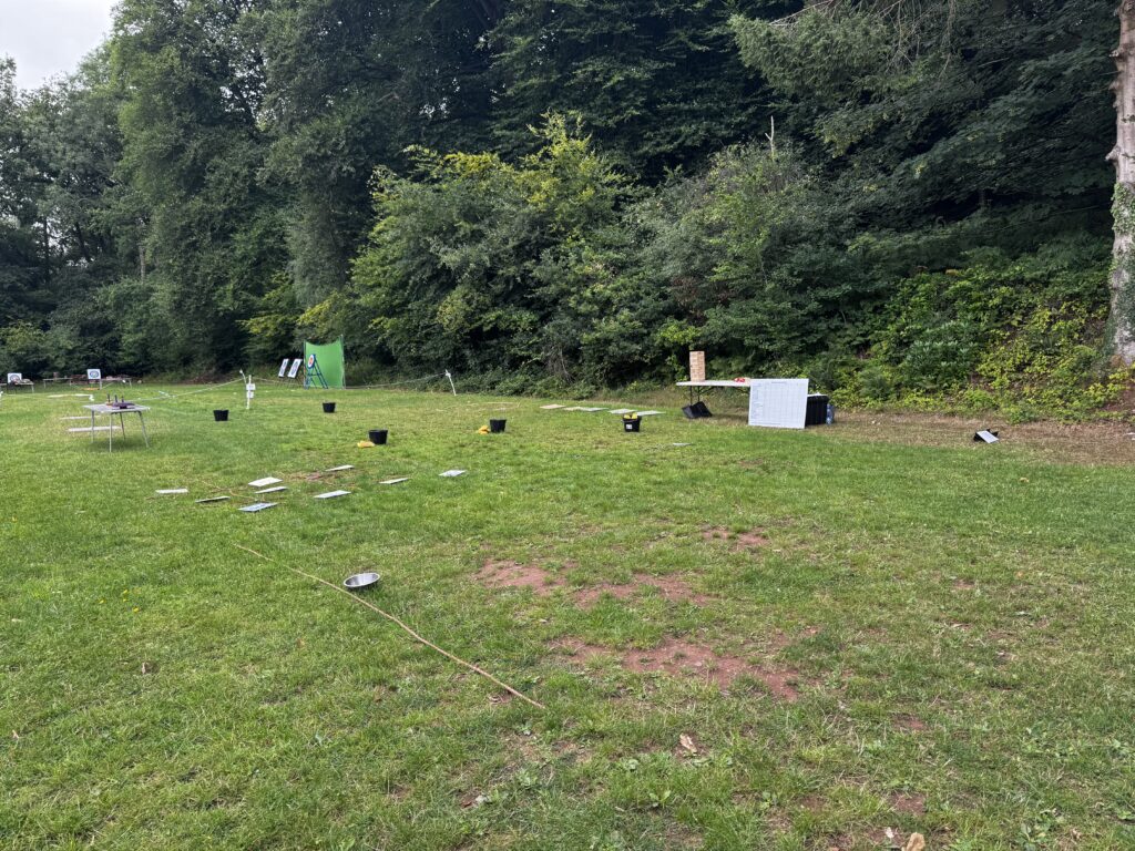 A selection of problem-solving activities laid out in a field.